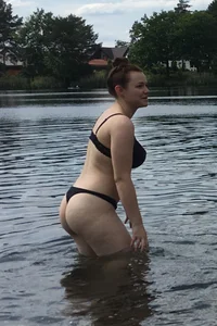 Big boobed babe at the lake in a black thong with blonde friend