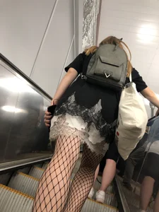 Cute Girl in Lacey Semi-Transparent Dress and Fishnet Pantyhose Subway Escalator Candid Photos Gallery
