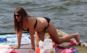Thick babe with big boobs in a black bikini