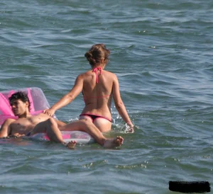 A bunch of sexy beach voyeur babes in bikinis, thongs and topless