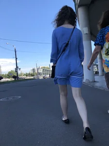 Girl in a Blue Dress With Pale Legs Walking Down the Street - Strong Wind Making Her Panty Line Visible