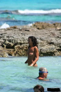 Nude beach ladies in the water showing their tits