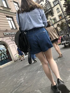 Candid teen in denim shorts