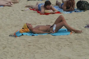 Topless girls on a beach in Barcelona