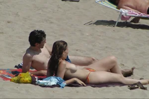 Girls on a nude beach in Sitges, Spain