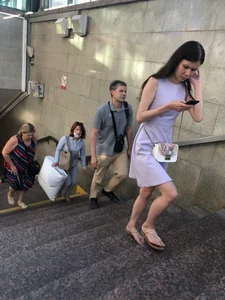 Girl in a Dress and Sandals Subway Closeups Photos of Legs
