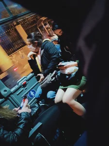 Nice legs of a candid girl wearing a skirt sitting in a public bus creepshots