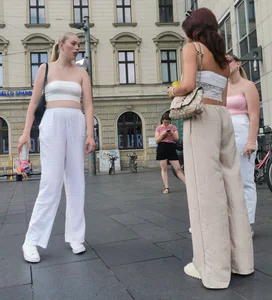 Long blonde braless in a white outfit (many pictures)
