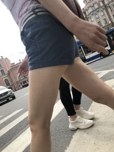 Young Girl in Shorts And Sandals Crossing the Street Gallery