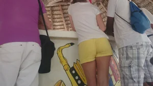 Milf in yellow shorts with vpl and a wedgie