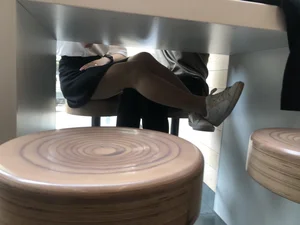Girl in a Skirt and Pantyhose Touching Herself Under a Table at a Restaurant Creepshots Collection