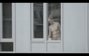 Topless chick in the window
