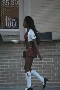 Sexy ebony Tilted Kilt employee in her uniform