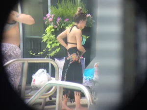 Hot girl at the pool in her bikini with big tits