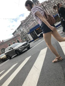 Young Girl in Shorts And Sandals Crossing the Street Gallery
