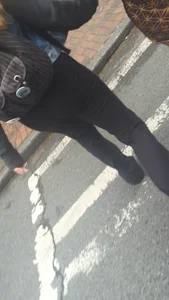 Girl with a nice ass in leggings walking down the street