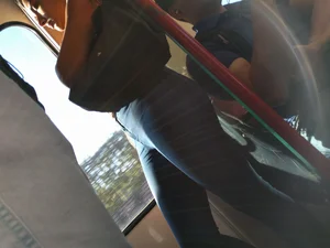 Train girl in tight jeans with a nice ass standing around