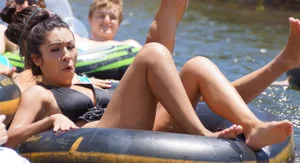 Sexy party girls in bikinis on a lake
