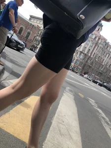Great legs and booty in spandex shorts of a street candid girl crossing the street