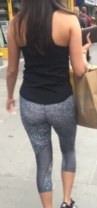 Sexy girl walking in grey patterned leggings with friend in tight jeans