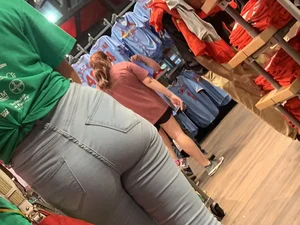 Bunch of girls in various outfits at a Cardinals baseball game