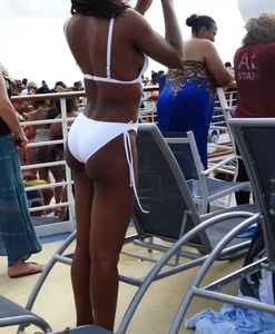 Sexy Ebony babe on a cruise in white bikini