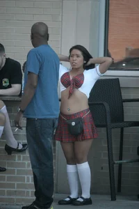 Two sexy Tilted Kilt employees showing cleavage and cheeks