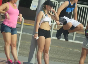 Couple of babes standing around in shorts