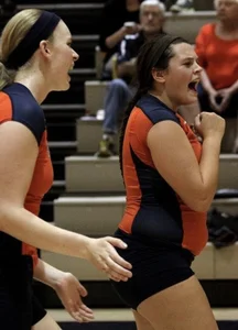 Teen girls playing volleyball
