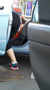 Girl in tight see through leggings with nice ass cleaning her car