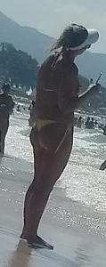 Big booty white chick in a yellow thong at the beach