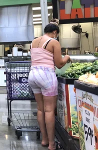 Thick Latina babe with a nice ass in tight patterned shorts