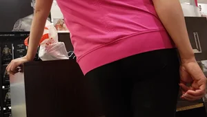 Nice ass in leggings standing in line shopping
