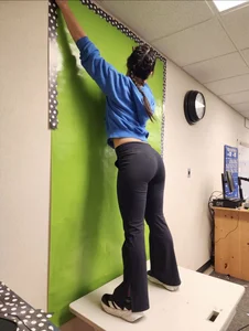 Great ass in tight black jeans, office girl in a hoodie