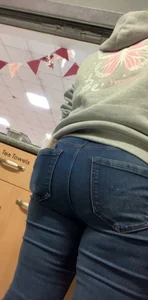 milf's ass in blue jeans closeup