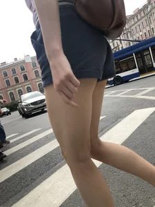 Young Girl in Shorts And Sandals Crossing the Street Gallery