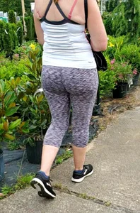 Milf booty in tight leggings shopping for plants