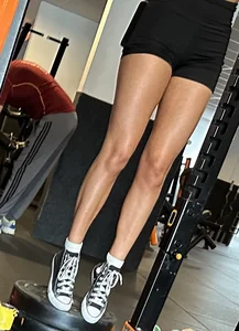 Hot tanned girl in gym with amazing legs and tight ass