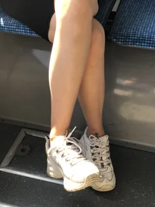 Candid girl sitting in a bus hot legs closeups