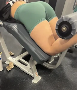 Green shorts bent over