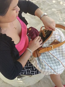 Asian chick downbloused showing nice cleavage and some bra
