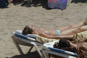 Girls on a nude beach in Sitges, Spain