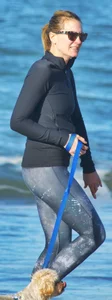 Beach redhead milf in patterened leggings at the beach