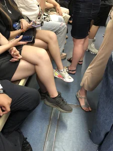 Hot Girls in a Subway Train Sitting With Crossed Legs Closeups And Flashing Booties Under Skirt