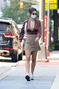 Emily Ratajkowski in mini skirt out for a walk with a friend in New York