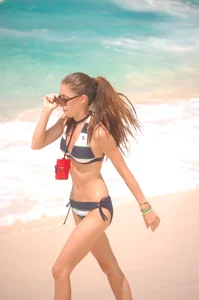 Bunch of sexy girls and milfs in bikinis at the beach