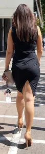 Brunette looking sexy in tight black dress with vpl