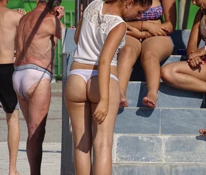 Sexy big bootied Latino girl in see thru underwear thong and white top with no bra