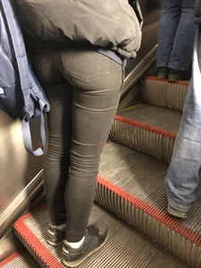 Booty in Tight Black Jeans on the Escalator Closeup Candid Photo