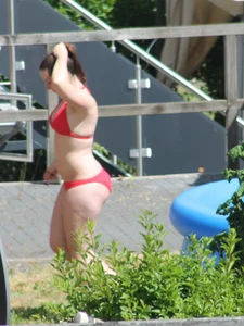 Thick babe in the backyard in red bikini